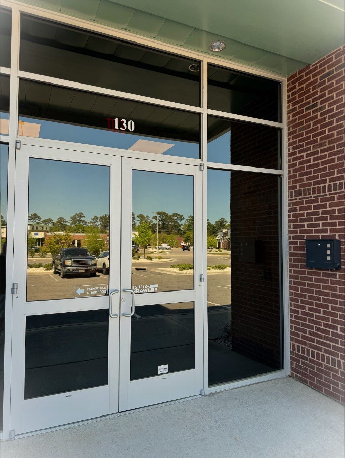 Minto Brawley new office front doors in NC. Minto Brawley logo on clear glass from doors.